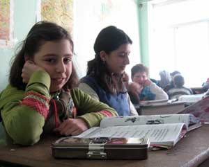 Mari Mangoshvili (left) and her friend Khatia Danelia in class at School No. 21, one of 10 schools in Tbilisi selected for a pilot project on inclusive education. Photo by Tamar Kikacheishvili.