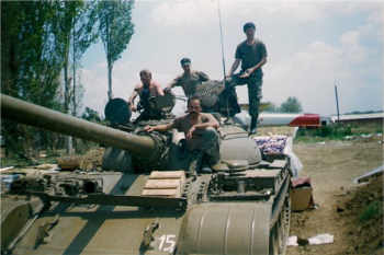 A Macedonian army reservists tank crew at the battle for the village of Aracinovo. Photo by Military Journal/Wikimedia Commons.