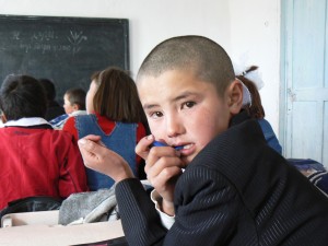 Kyrgyz schoolboy. Photo by Ben Paarmann. Creative Commons licensed.