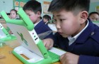 A Mongolian student tries out an OLPC laptop. Photo by Carla Gomez.