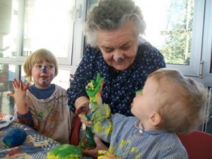Together Old and Young (TOY) promotes bringing young children and older people together.